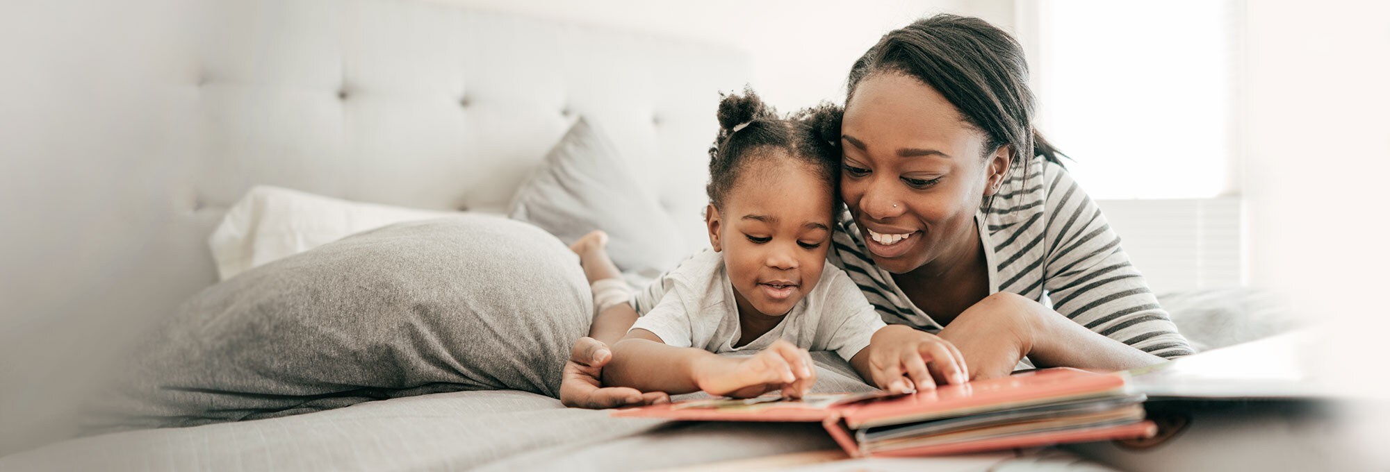 Mother and daughter reading a book