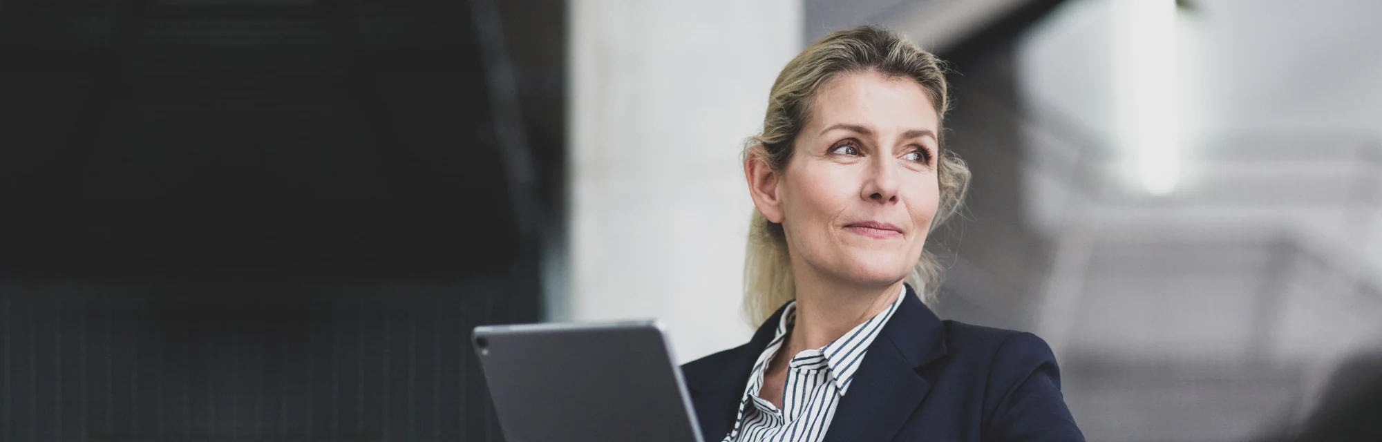Woman using her tablet to sign on to Osmond Credit SmartBanking for Business