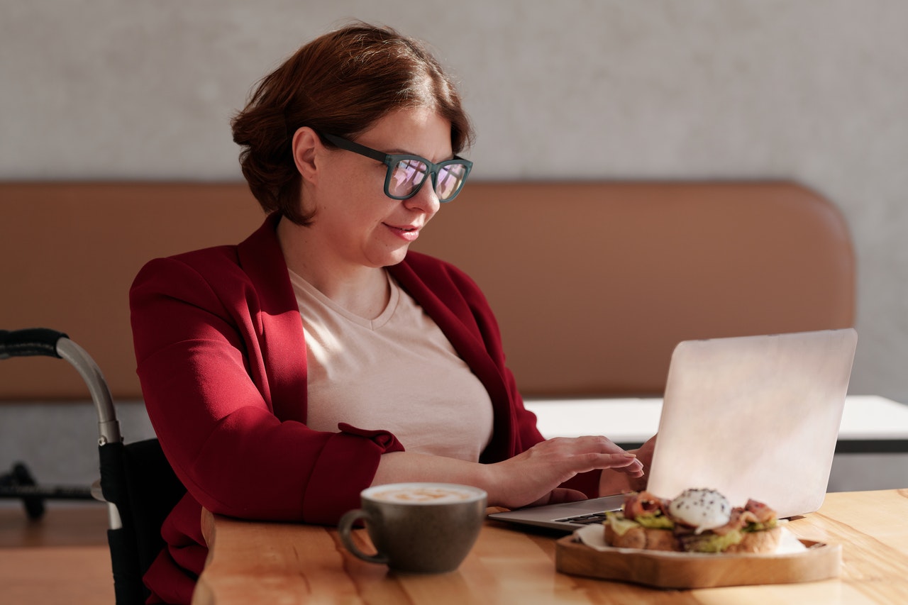 A woman reviewing her business finances on a tablet